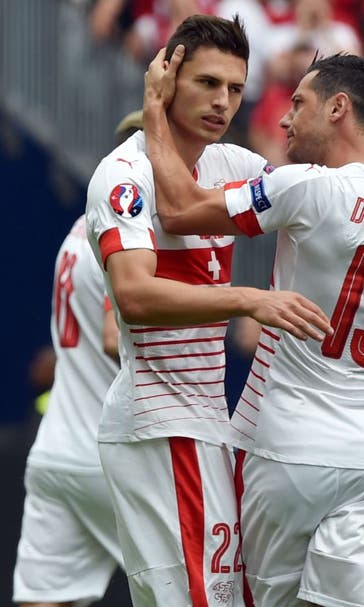 Schar helps Switzerland to tight victory over 10-man Albania